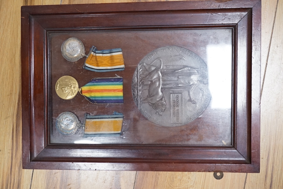 Two First World War medal groups; a framed medal trio and memorial plaque awarded to Pte. George William Stannard R.M. R.N. Division, with the scroll in a separate matching frame, together with a medal pair awarded to 20